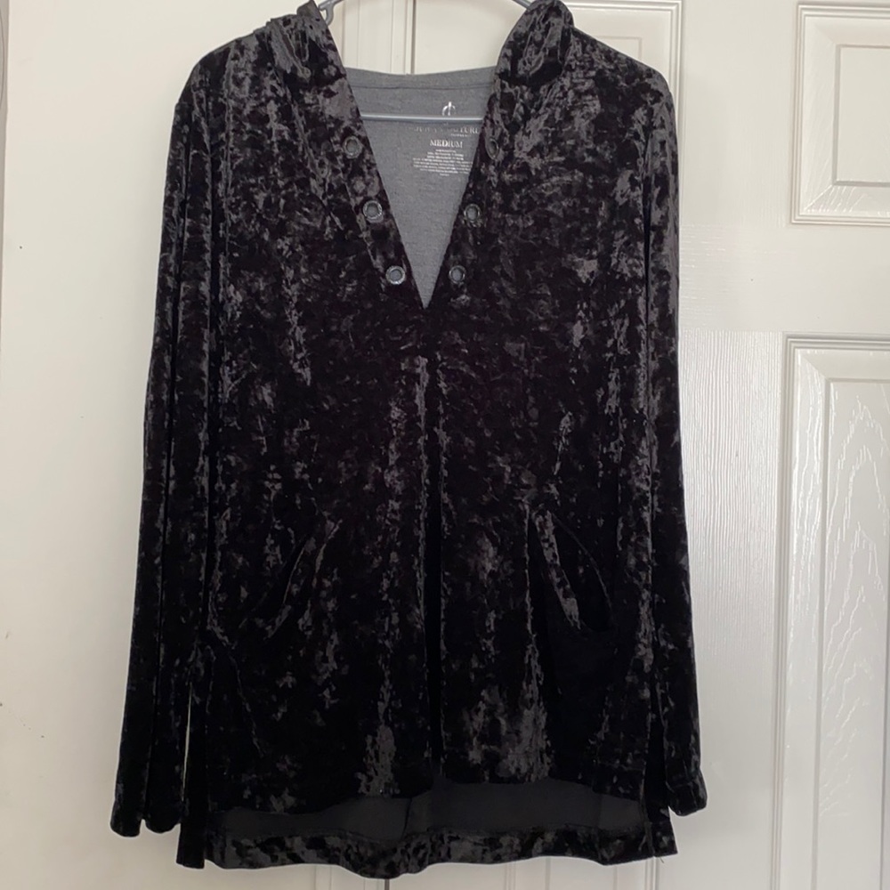 A black, velvet, long sleeve shirt, with a hood